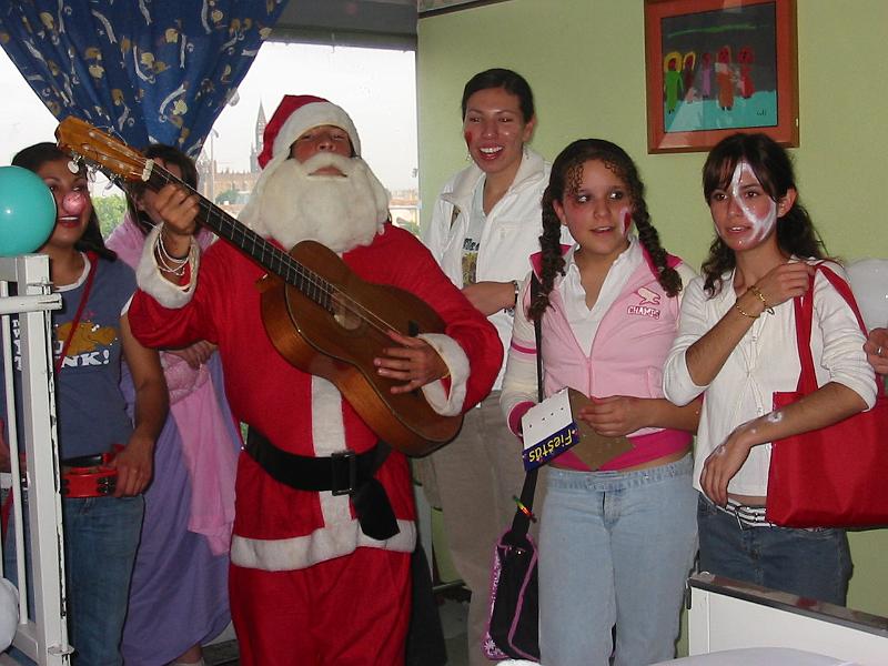 4-22.JPG - A group of teens came to sing for the kids in the hospital! God bless these concerned young people who brought toys and goodies for the sick kids stuck in the hospital at Christmas time!